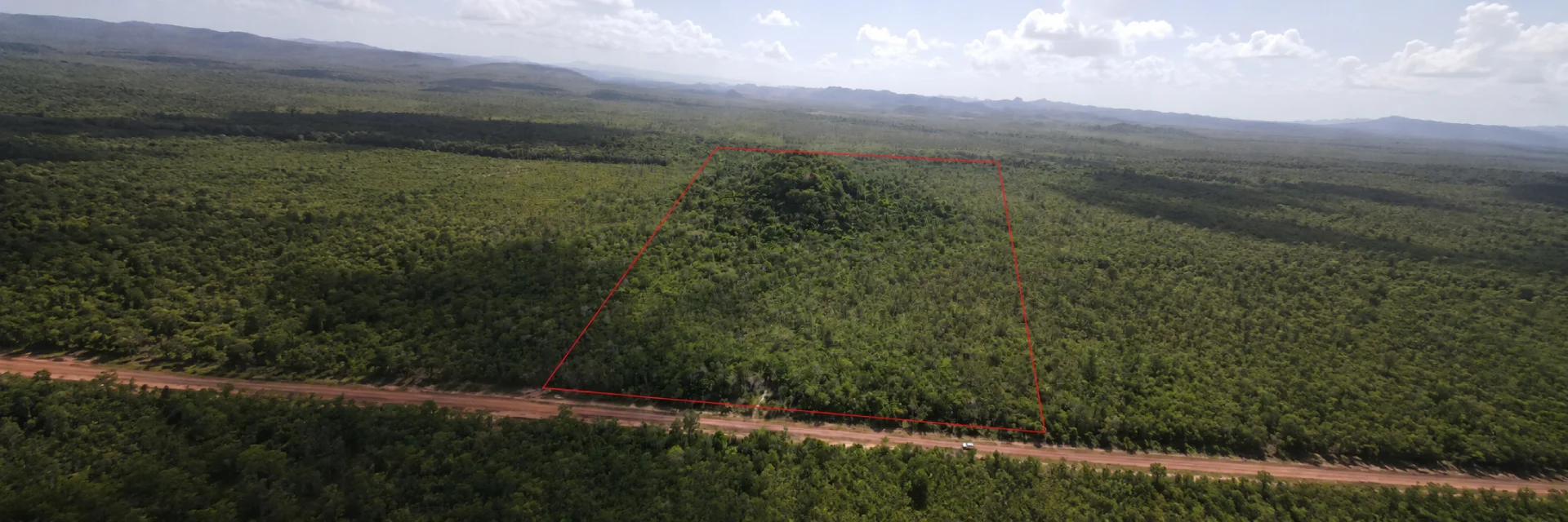 49-Acre Jungle Land for Sale in Belize – Coastal Road with Year-Round Creek, Caves & Fertile Soil
