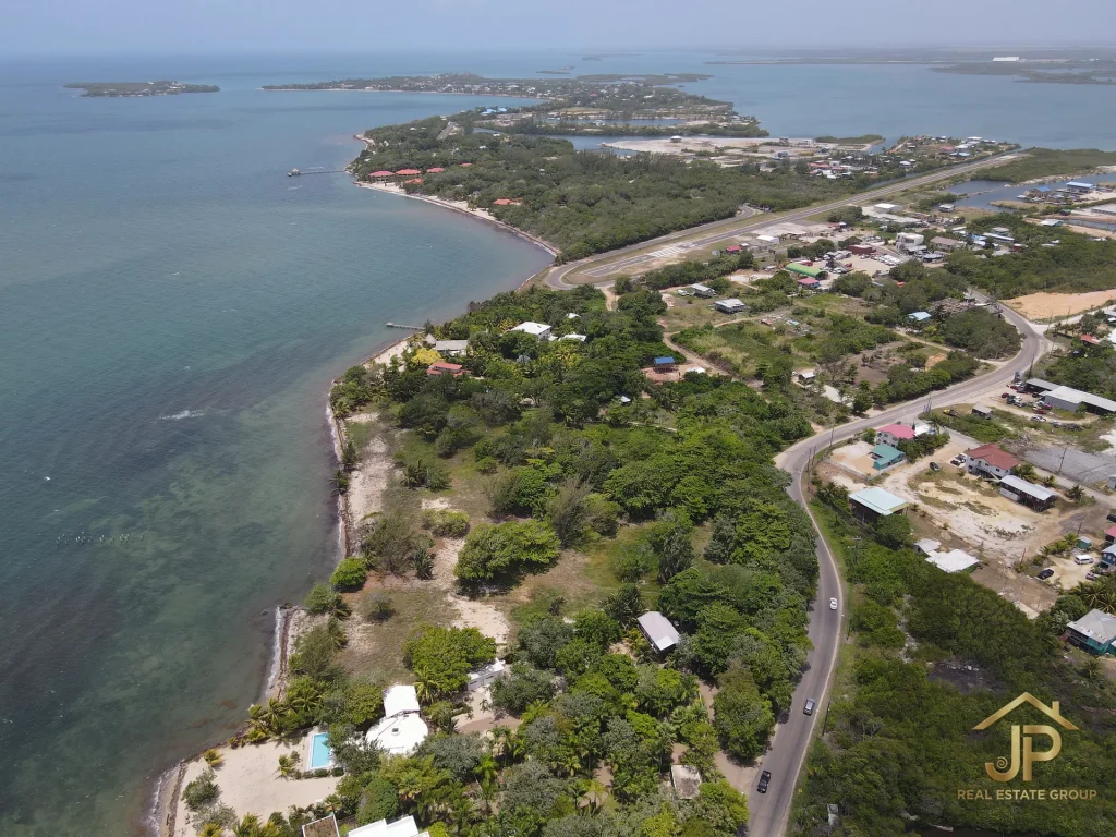 Placencia Peninsula lot for sale aerial view near airport and Caribbean coast - JP Real Estate Group
