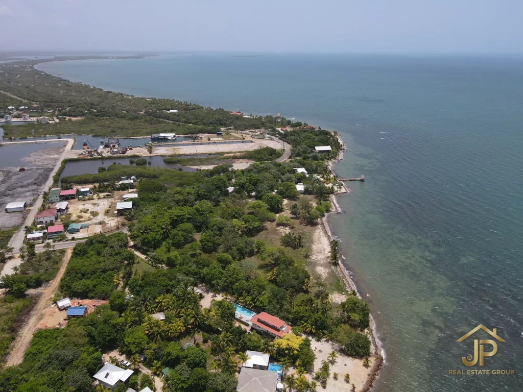 Rum Point lot for sale aerial view with shoreline and residential surroundings - JP Real Estate Group