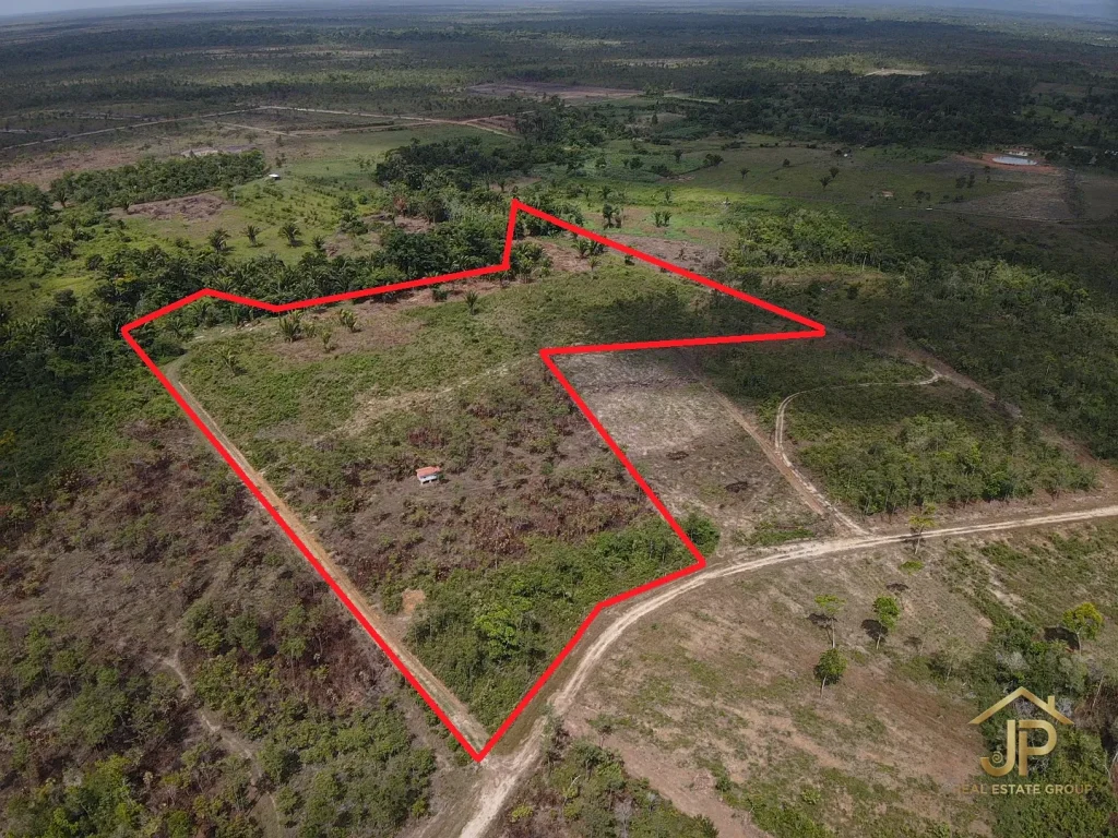 Santa Cruz Belize farmland aerial view with Maya Mountains and cleared acreage - JP Real Estate Group