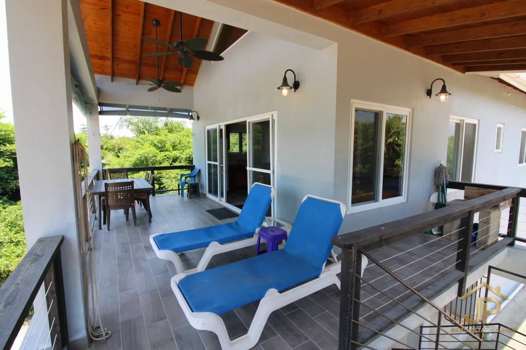 Outdoor deck and sliding doors at Caribbean Way beach view duplex
