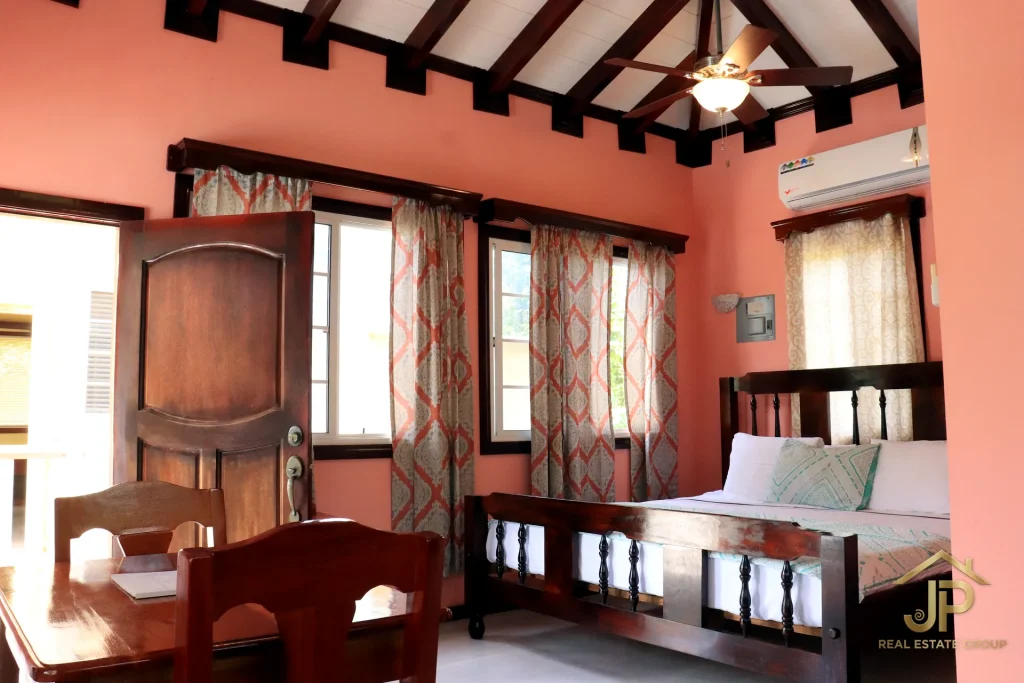 Hummingbird Estate resort cabana interior with exposed ceiling beams 2