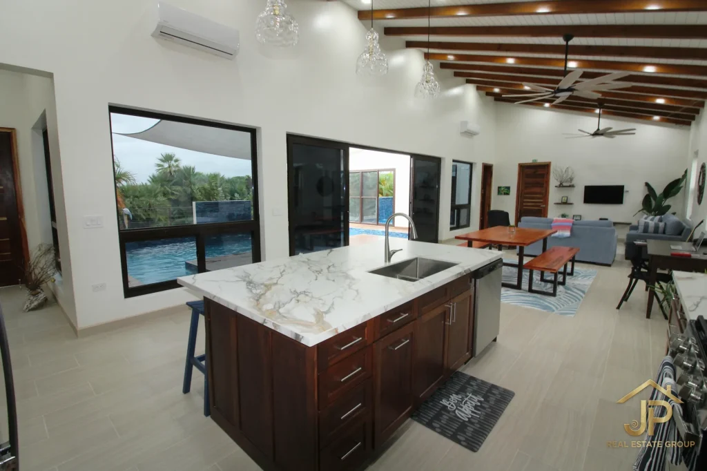 Kitchen island in furnished Naia waterfront home