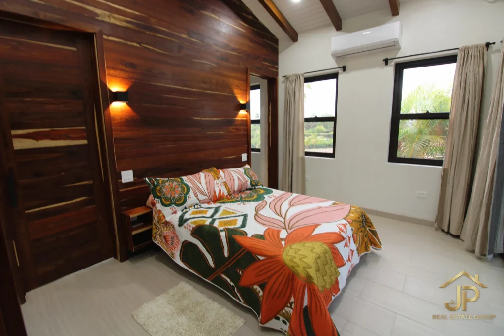 Second bedroom angle in furnished Naia Placencia home