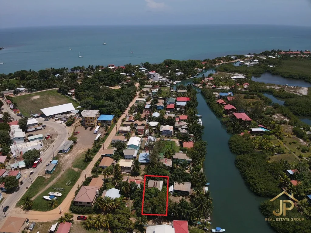 central Placencia Village investment property aerial view near canal and sea - JP Real Estate Group