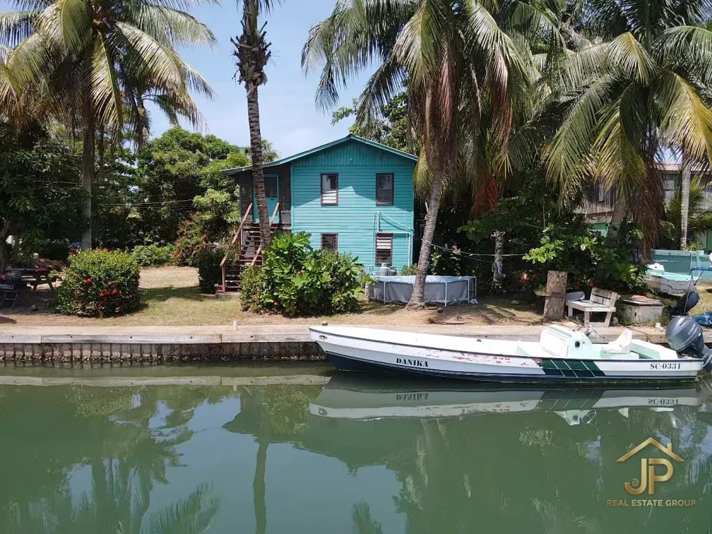 aerial view of Placencia Village waterfront neighborhood and Caribbean Sea - JP Real Estate Group
