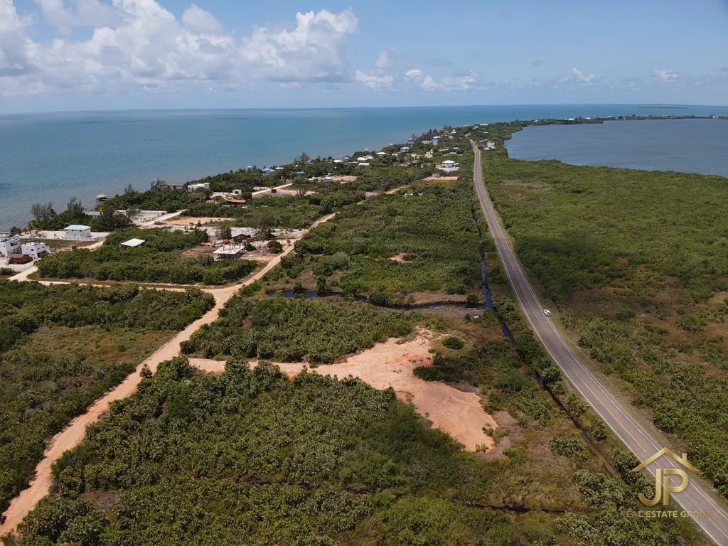 beach access land for sale in Placencia Belize with lagoon and shoreline context - JP Real Estate Group