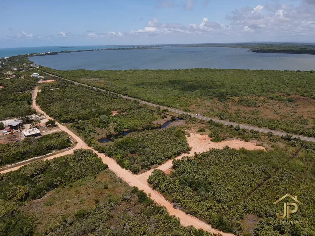 marked Caribbean Way Placencia lots with beach access route and lagoon-side context - JP Real Estate Group