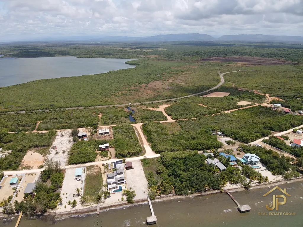 Placencia beach access lots marked in coastal neighborhood aerial overview - JP Real Estate Group