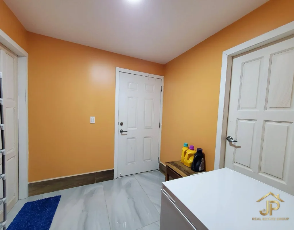 Bathroom vanity and shower in Placencia Village hotel listing