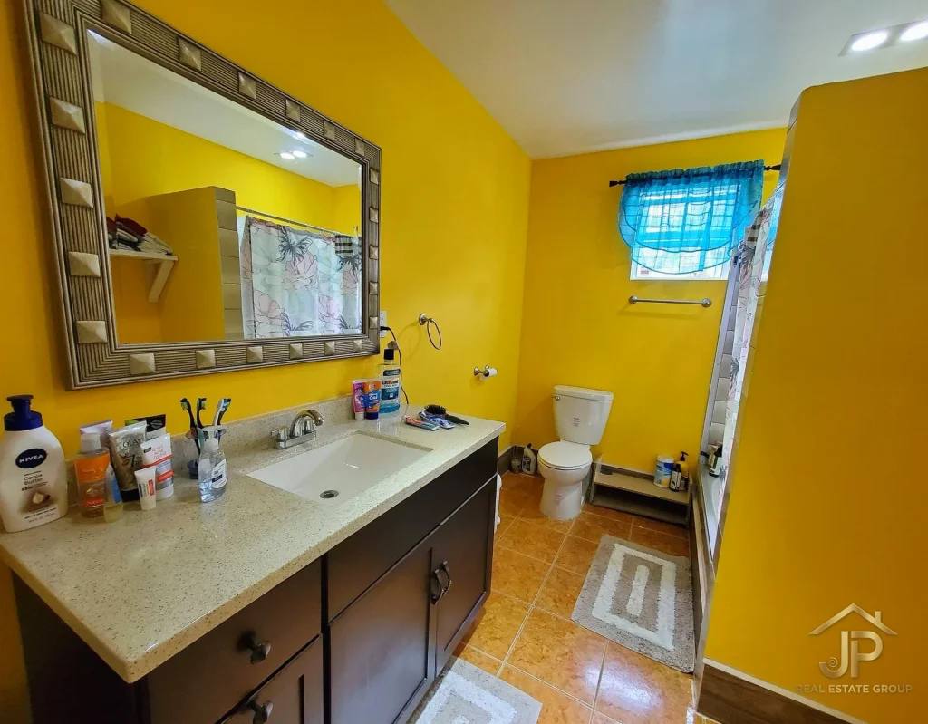Guest room with air conditioning in Placencia Village hospitality property
