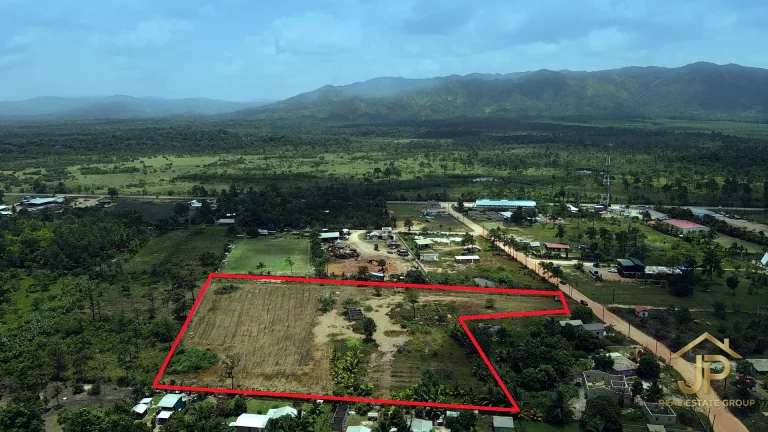 Aerial view of the 5-acre Santa Cruz Village property boundary with mountain backdrop