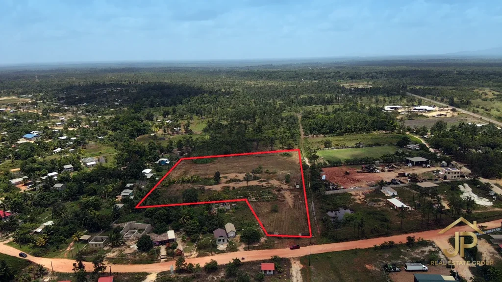 Aerial boundary view of the 5-acre Santa Cruz lot and village road frontage