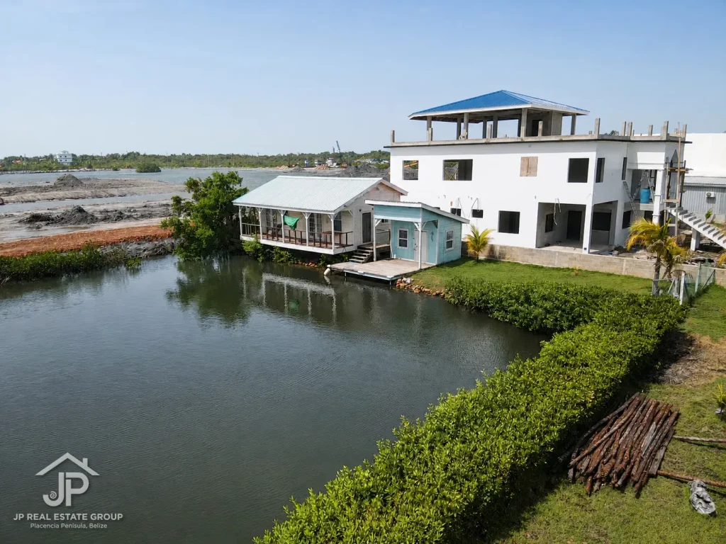 Canal-front cabana with private boathouse and dock on the protected basin