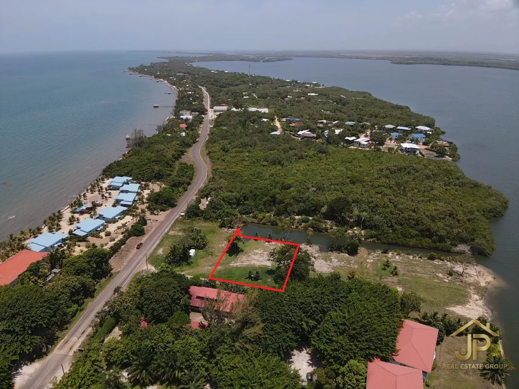 canal front lots for sale in Placencia Belize marked lot aerial with peninsula and Caribbean Sea - JP Real Estate Group
