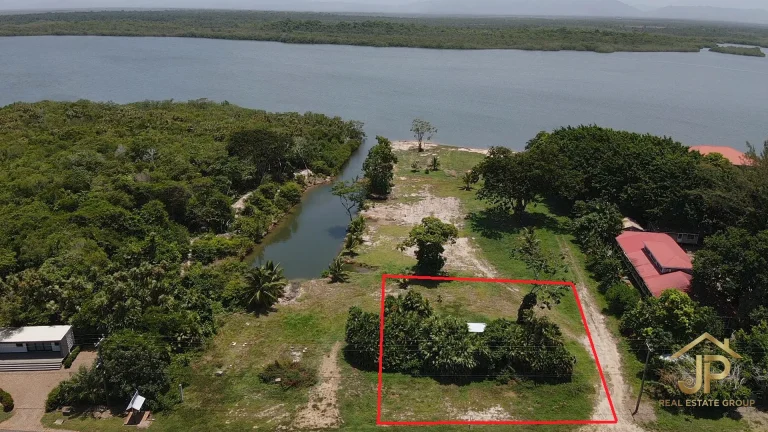 commercial land for sale in Maya Beach Placencia marked road-front lot aerial with highway frontage - JP Real Estate Group