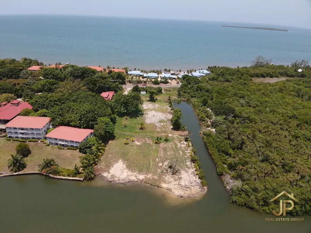 waterfront development land Maya Beach Placencia aerial with lagoon frontage and canal - JP Real Estate Group
