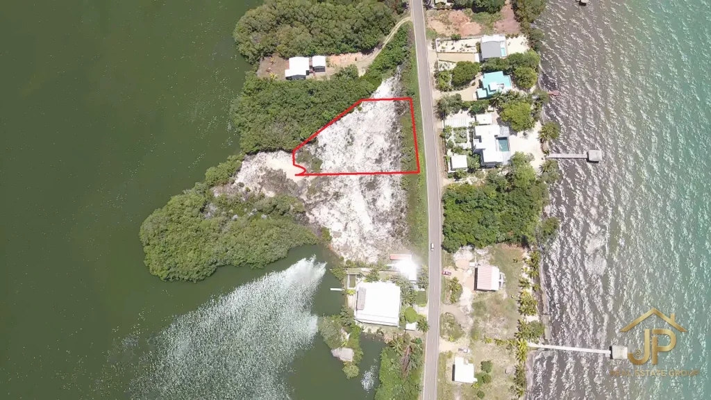 parkfront Placencia lot with Caribbean Sea behind it - JP Real Estate Group