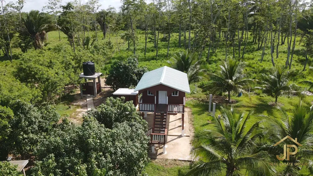 worker housing and tropical grounds on Belize ranch - JP Real Estate Group
