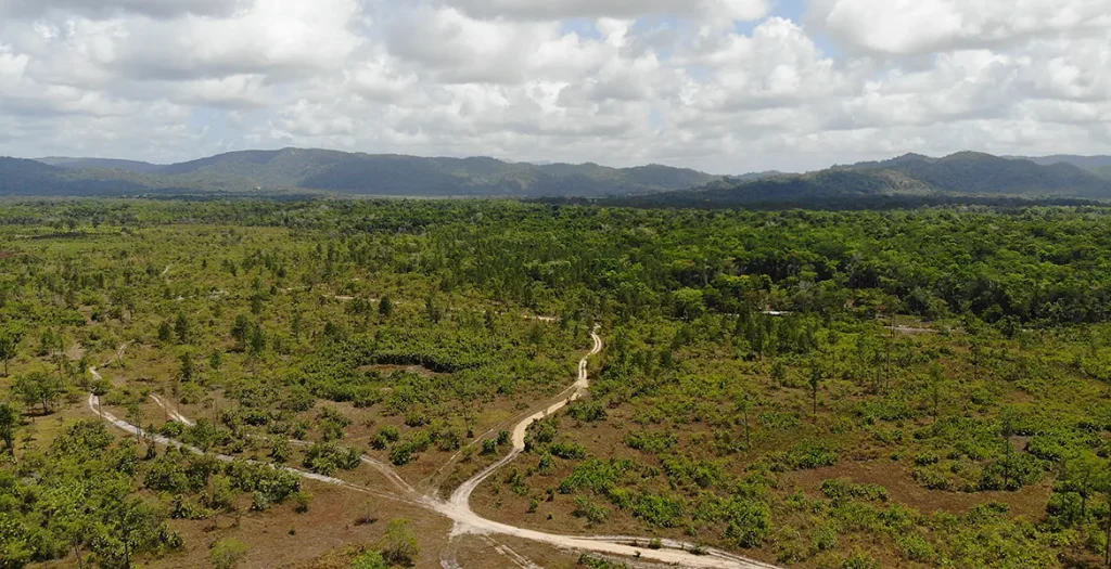 Aerial view of the 25-acre Georgetown property with access roads and mountain backdrop