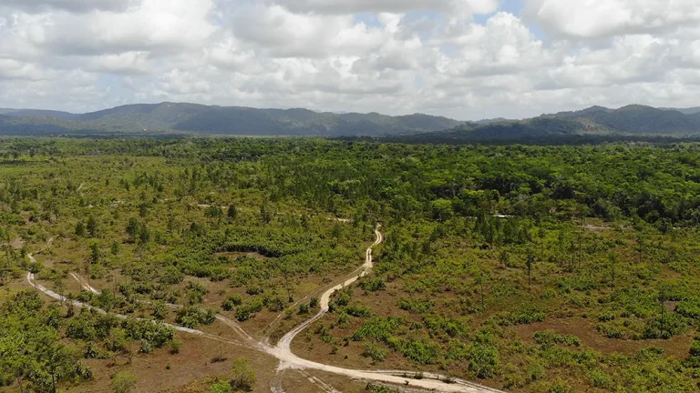 Aerial view of the 25-acre Georgetown property with access roads and mountain backdrop