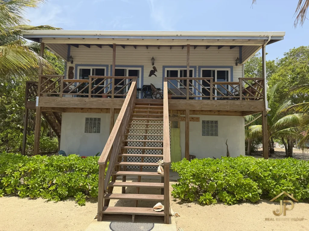 Front view of the elevated main residence at the Mayacan beachfront property