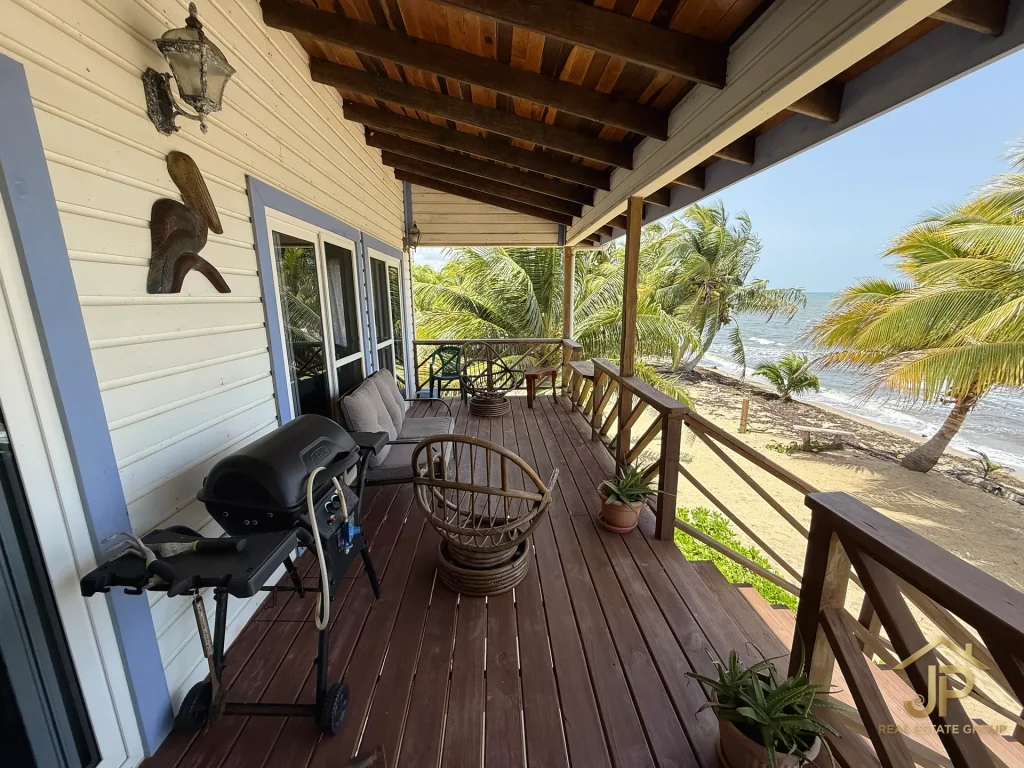 Covered ocean-view veranda at the Mayacan beachfront residence