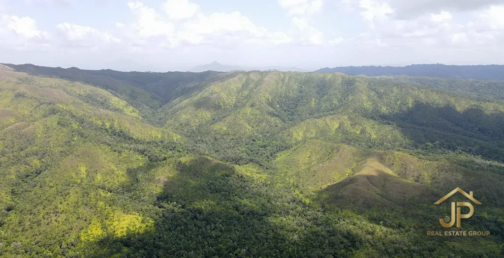 Aerial view of green mountain ridges near the Kendall property