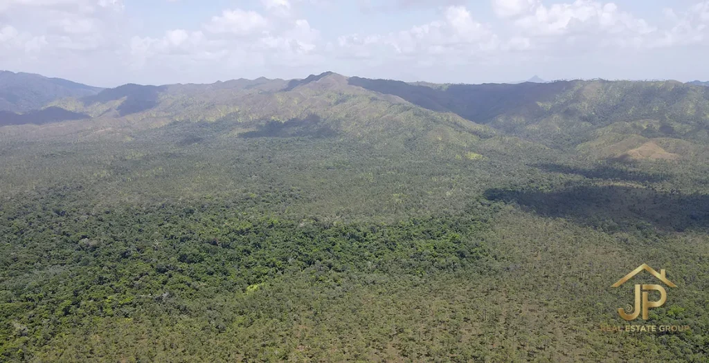 Wide aerial landscape of forest and mountain ridges near Kendall, Belize