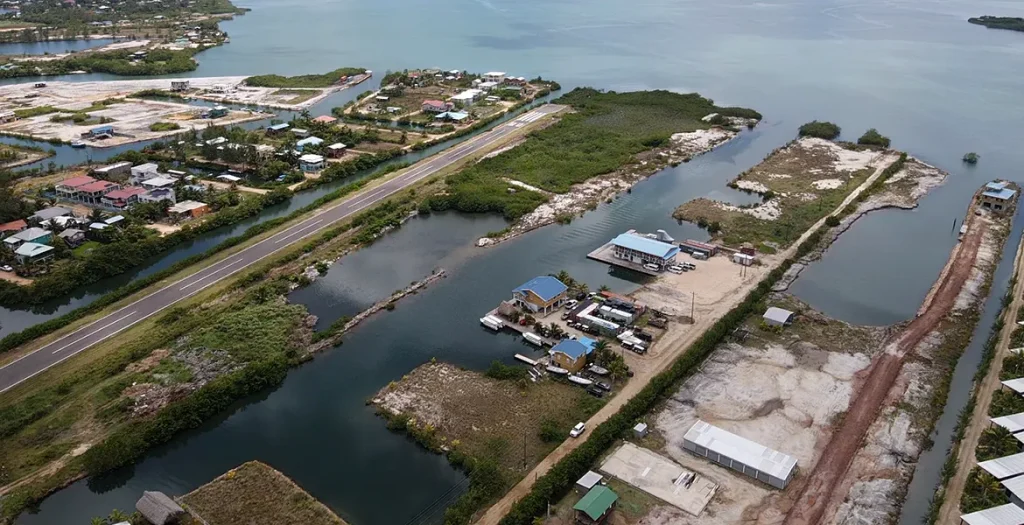 Aerial overview of Placencia Harbor waterways near the 0.50-acre waterfront lot