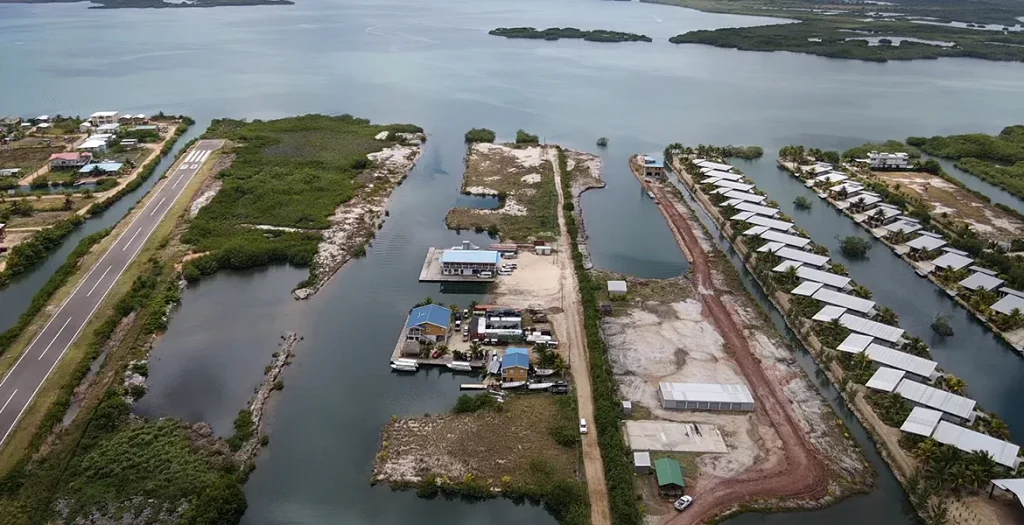 Aerial view of the harbor channel and surrounding waterfront properties in Placencia