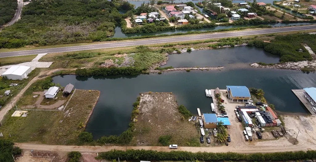 Overhead view of the waterfront parcel area and neighboring properties in Placencia Harbor